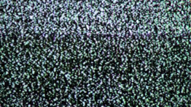 Static noise on a television screen, a classic sign of no signal or interference, creating a retro, vintage, and abstract visual effect.