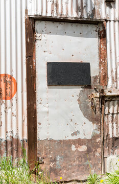 Canada, Alberta, Turner Valley.  Old rusted doorways in the Turner Valley Gas Plant, historic site.