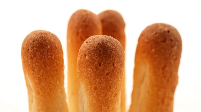 Closeup Macro Shot of Five Breadsticks Standing Upright.