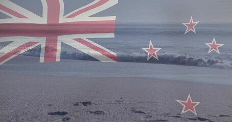 Naklejka premium Showing faint New Zealand flag overlay over shore, revealing wet sand, footprints and waves