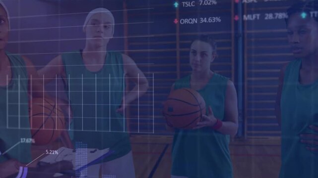 Vertical video: Gesturing coach using clipboard, tablet at gym, team in green jerseys viewing stats