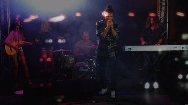 First drum beat starting, lead vocalist leaning into mic and stepping forward to emphasize chorus