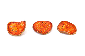 Dried Bael Fruit slices isolate on a white background. A premium natural ingredient for preparing traditional herbal drinks