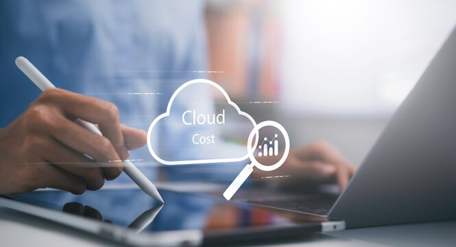 Businesswoman using digital tablet and laptop analyzing cloud cost data via virtual interface. Concept of cloud computing management financial analytics data monitoring and business strategy