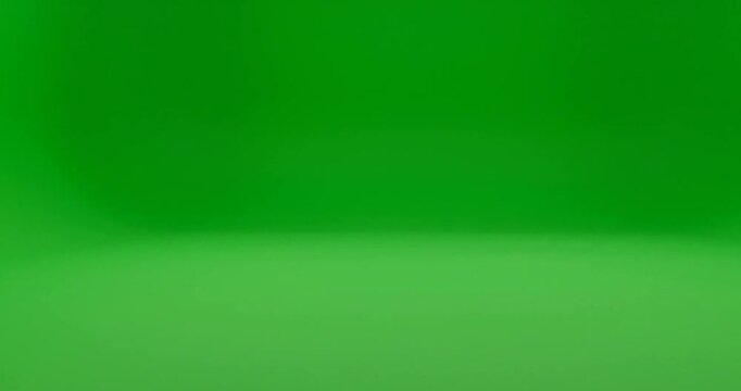 Vibrant green gradient studio background with soft lighting effect