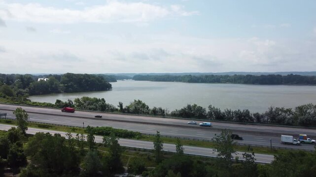 Aerial shot of vehicle traffic on the QEW, Queen's Expressway in southwestern Ontario, Canada. The harbour at Jordan, within Lincoln, on the southern shore of Lake Ontario between Hamilton and Niagara