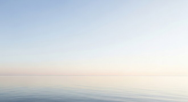 An unbroken horizon line where a vast calm ocean meets a soft pastel sky at dawn or dusk
