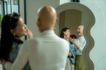 Obraz premium Friends laughing together in mirror enjoying skin care
