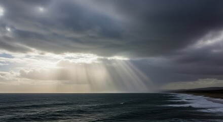 Obraz premium Brooding leaden clouds with rain shafts reaching across the dark ocean.