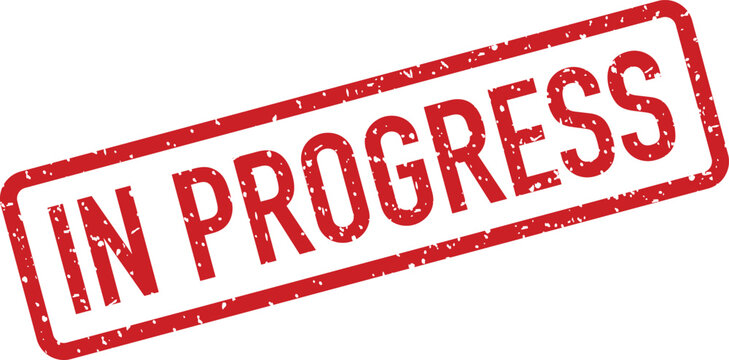 A bold red grunge rubber stamp clearly shows the words IN PROGRESS in capital letters on a bright white background