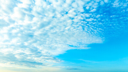 A bright, clear blue sky meets a glowing white horizon, suggesting a serene, open, and with sunlight of beautiful cloudy sky. landscape or abstract background	
