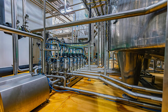 Pipe stainless steel tanks with pressure meter in equipment tank chemical cellar at the with stainless steel