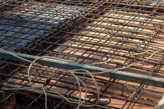 Steel rebar grid framework for concrete floor slab casting at a building construction site
