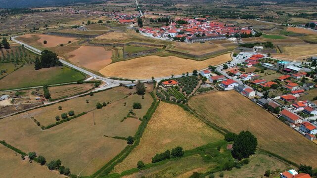 Aerial panoramic view above the old town of the city and fortes Almeida in Portugal on a sunny summer day .