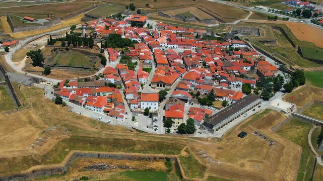 Aerial panoramic view above the old town of the city and fortes Almeida in Portugal on a sunny summer day .