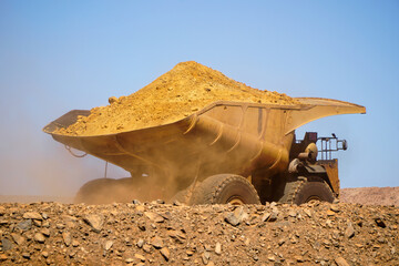 Western Australia mining town of Kalgoorlie a heavy mining dump truck hauling dirt across open pit © electra kay-smith