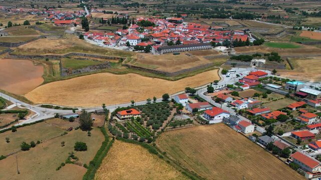Aerial panoramic view above the old town of the city and fortes Almeida in Portugal on a sunny summer day .