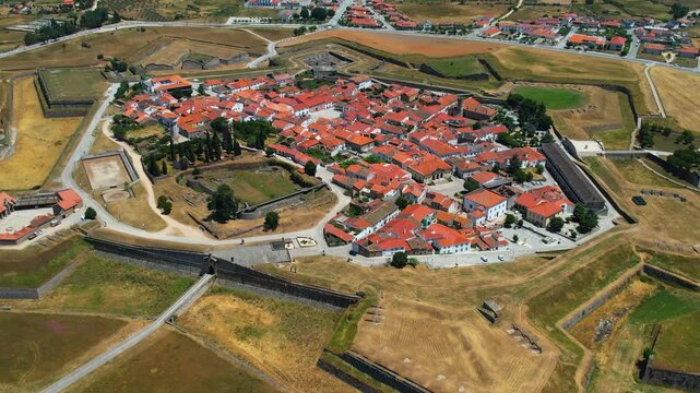 Aerial panoramic view above the old town of the city and fortes Almeida in Portugal on a sunny summer day .