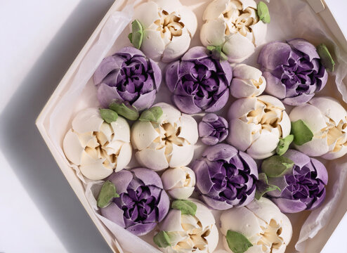 Homemade marshmallows in the shape of purple tulips. Sweets in a healthy diet. 