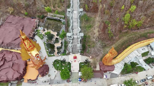 Aerial view of Wat Pa Phutthachinwong temple in Phu Kamyao District, Phayao province of Thailand. This temple has a Thailand's most biggest Naga sculpture (909 m long).