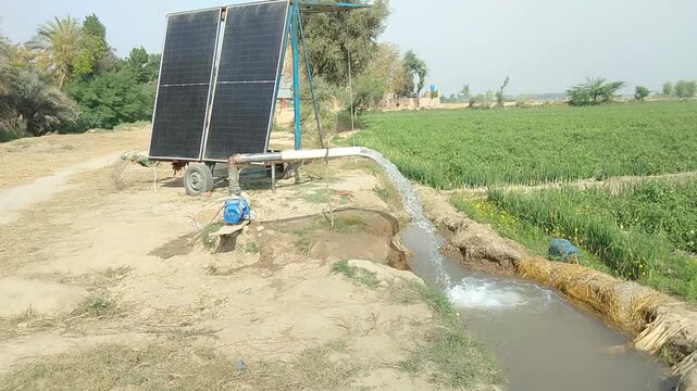 Solar Powered Water Pump Irrigating Agricultural Field in Rural Farm