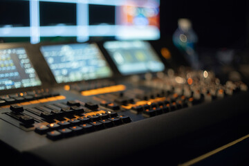 Professional Control Console with Glowing Buttons in Studio with Copy Space