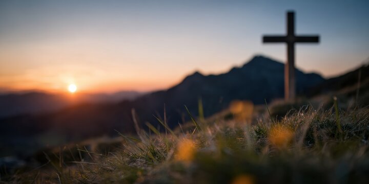 Christian cross standing on mountain hill during sunrise with copy space for community outreach, church branding, and religious spiritual marketing background