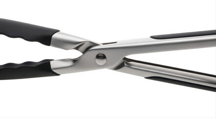 Fototapeta premium Stainless steel salad tongs with black grips isolated on a pristine white background