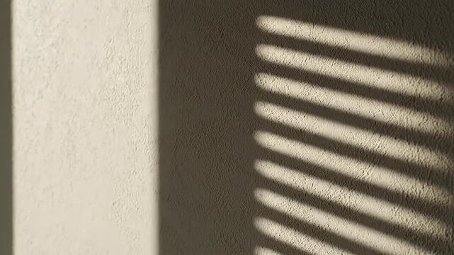 Sunlight casting striped shadows on a textured wall.