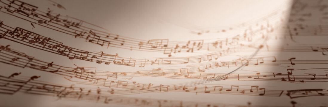 Beautiful music sheet background with intricate notes and symbols, creating sense of harmony and creativity. warm tones evoke nostalgic feeling of musical artistry