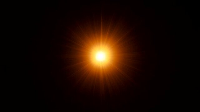 Abstract view of radiant sunburst with vibrant color and a burst of light against the darkness