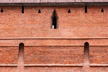 Moscow Kremlin red brick fortress wall with loopholes and architectural details