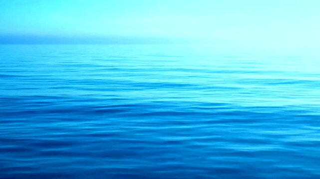 Ocean's Calm Embrace: Capture the vast expanse of the ocean. The gradient of the sea, where sky kisses water, conveys feelings of peace and tranquility.