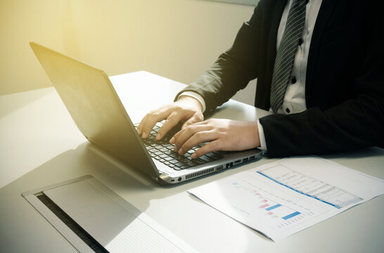 The business man working process analyze the data to prepare for the presentation on lapop at office, business concept abstract banner background with copy space for text