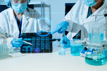 Fototapeta premium Scientist conducting medical research in modern laboratory using digital healthcare interface, biotechnology analysis, pharmaceutical testing