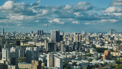 Fototapeta premium Moscow city skyline with Ostankino Tower under a cloudy blue sky