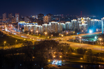 Obraz premium Minsk city night panorama with illuminated roads and residential buildings