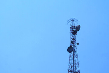 Telecommunication tower reaching high into the sky, broadcasting signals