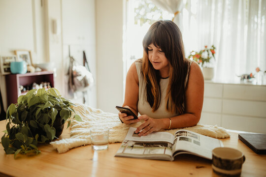 A Woman working at a table from home