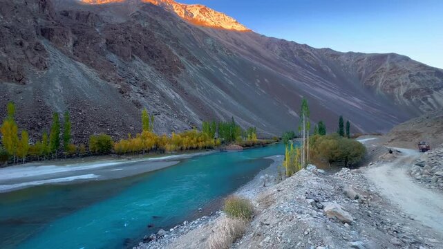Cinematic horizontal 4K footage of Majestic Landscape of Gupis Valley with Winding Gilgit River in turquoise color, Gilgit-Baltistan, Pakistan