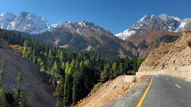 Cinematic 4k horizontal footage of Driving on Scenic Naltar Highway , Gilgit Baltistan, Pakistan - Snow-Capped Peaks - Naltar Highway - POV Forward Motion - Northern Pakistan Road Trip