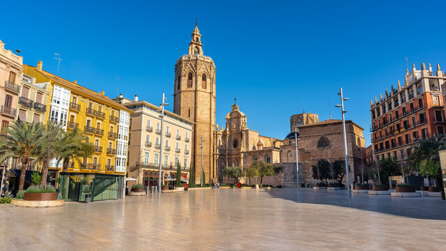 Great panoramic view of the Plaza de la Reina with the cathedral in the background surrounded by historic buildings, Valencia, Spain