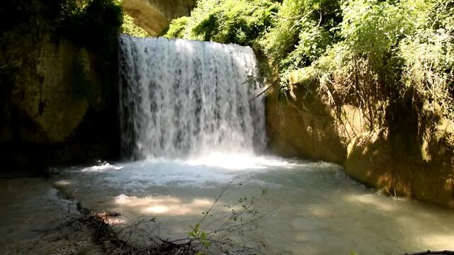 waterfall among the trees, view from below