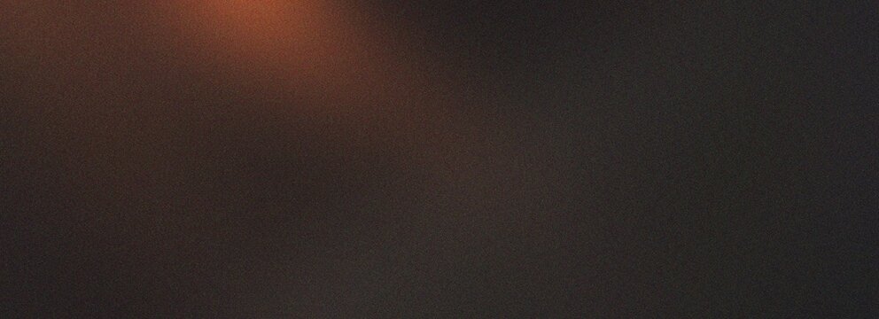 Warm moody grain background with dark orange and brown tones featuring subtle light effects for vintage cinematic aesthetic and artistic design needs