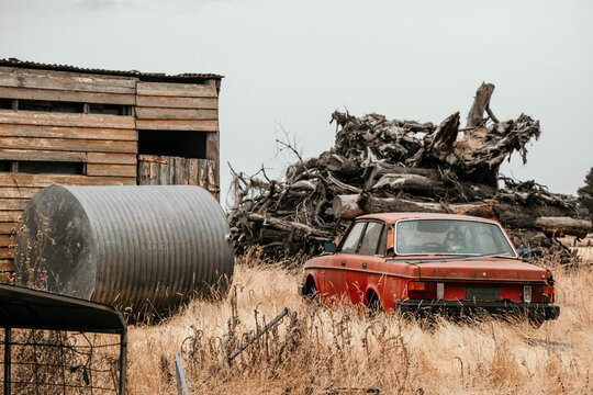 Old shed, water tank, bonfire stack and rusted car