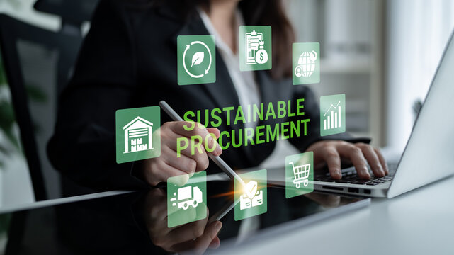 A business professional uses a laptop in a modern office, engaging with digital tools for sustainable procurement, highlighting innovation and technology for better resource management. Ledger