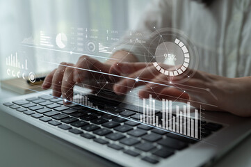 A person working on a laptop in an office setting, with graphic elements depicting data analytics...