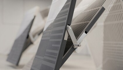 Pivoting acoustic panels in midmotion demonstrating mechanical adjustment for diffusion with outoffocus surroundings enhancing focus on panel design.