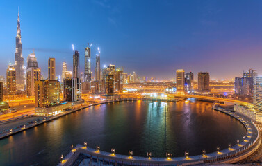 Fototapeta premium Dubai downtown and water canal with promenade after the sunset,Dubai,United Arab Emirates
