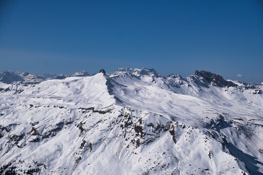 View from the summit of Hochfinsler between the cantons of St. Gallen and Glarus. Ski tour in the Swiss mountains.